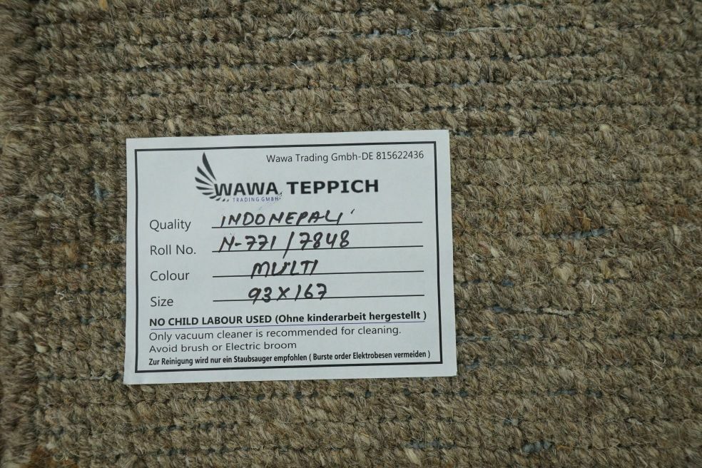 WAWA-Etikett auf der Teppichrückseite mit der Kennzeichnung N-771 / 7848 und der Farbangabe Multi.