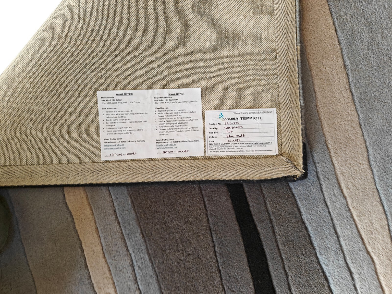 Rankomis dygsniuotas vilnonis kilimas, 120x180, mėlynas-margas, modernus svetainės dizainas, SH205